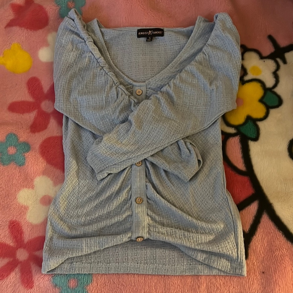 long sleeve knitted shirt with ruffles on the sides of the sleeves!!